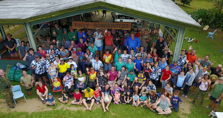 people standing under club house